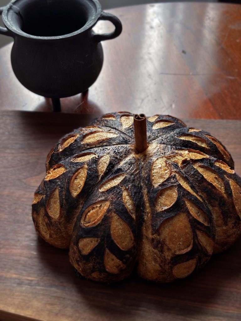 A pumpkin shaped loaf of sourdough bread